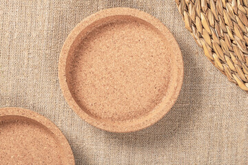 Top View of Cork Coasters on Burlap Background with Ample Space for Text