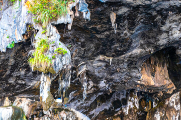 Limestone cave and longtail boats Koh Phi Phi Don Thailand.