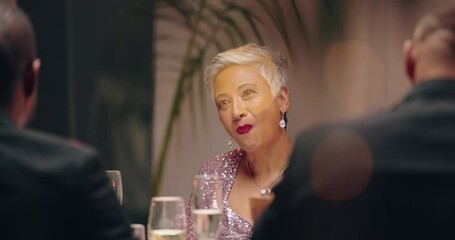 Woman, gala dinner or happy by table with fine dining, champagne or communication at colleagues for work event. Mature person, indian or smile in fashion or elegant in conversation at business supper