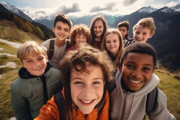 Group of happy children taking selfie on hike in the mountains - obrazy, fototapety, plakaty