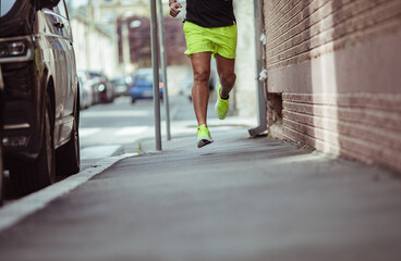 Man jogging in urban alley