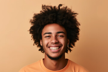 Fototapeta na wymiar african-american boy smiling on orange background
