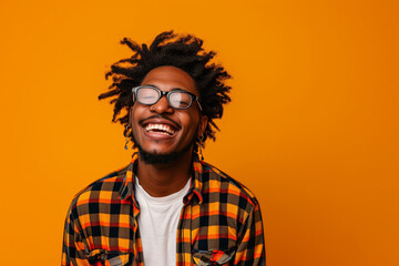 african-american boy smiling on orange background