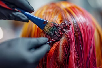 Fotobehang Schoonheidssalon Artistry in Hair Coloring: Vibrant Red Dye on Strands of Golden Hair