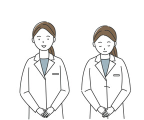 お辞儀をする白衣の女性