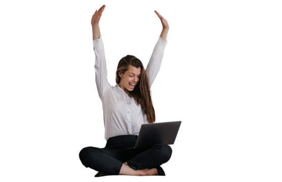Expressive young brunette businesswoman in glasses, white shirt and black pants making video call rising hands up against transparent background, celebrating great deal, laughing, screaming