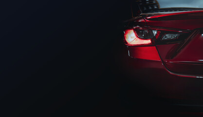 Expensive sports car concept. Modern luxury red cars, detail on one of the LED taillights modern...