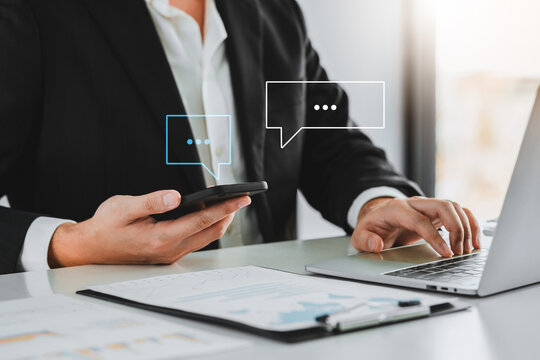 Chatbot chat AI concept, artificial intelligence Businessman using AI smart robot technology smartphone with Icon communication network social media network pop notification concept.