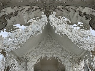 The White Temple (Wat Rong Khun), Chiang Rai, North Thailand. Its striking white color and the use of mirrors in its design are unique features that contribute to its ethereal beauty and symbolism.