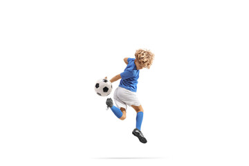 Boy kicking a football with backheel