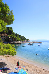 Summer day on the beautiful beach in Brela, Croatia.