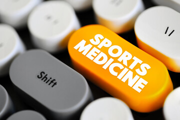 Sports Medicine is a branch of medicine that deals with physical fitness and the treatment and prevention of injuries related to sports, text concept button on keyboard
