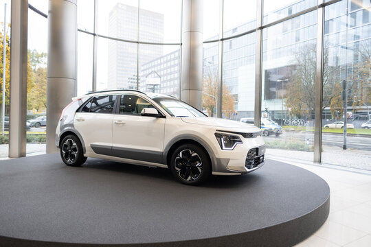new white electric Kia Niro EV Premium, South Korean e-Niro in showroom, trends in use EV in contemporary Europe, technological advancements in automotive industry, Frankfurt - November 9, 2023