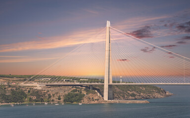 Obraz premium Yavuz Sultan Selim Suspension Bridge after sunrise, a suspension bridge that spans the Bosphorus Strait between Europe and Asia, located in Istanbul, Turkey