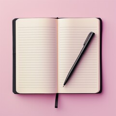 notebook and pen on light pink background