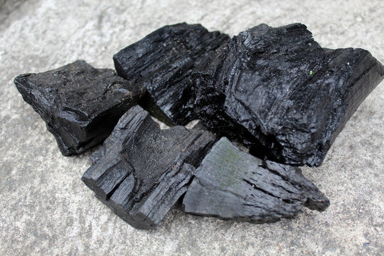 Charcoal from wood on grey background