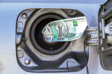 Russian rubles banknotes in the gas tank of a vehicle