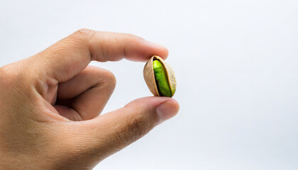 hand holding pistacho 