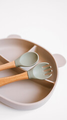 Set of silicone dishware for baby. First baby food concept, serving food for kids