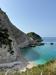 Agia Eleni beach, Kefalonia, Greece. Clear blue waters of Ionian Sea and mountain coastline