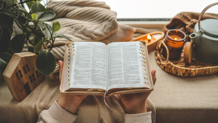 Girl holding a Bible, morning prayer and worship