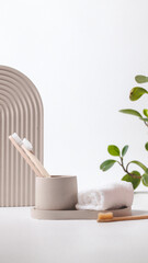 Bamboo toothbrushes in a stylish concrete glass on a white background