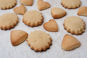 Homemade cookies of different shapes - hearts, stars and triangles, side view