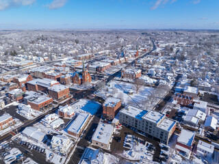 First Congregational Church and Town Common aerial view in winter on Central Street in historic town center of Natick, Massachusetts, USA.