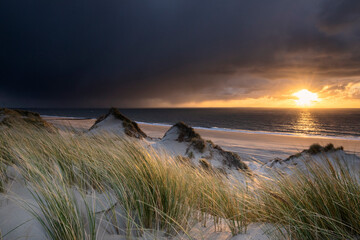 sunset over Dutch sea beach - 708050074