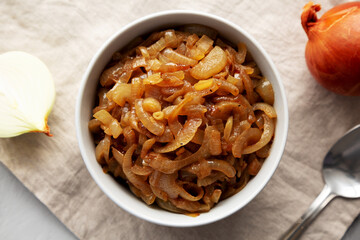 Organic Caramelized Onions in a Bowl, top view. Flat lay, overhead, from above.