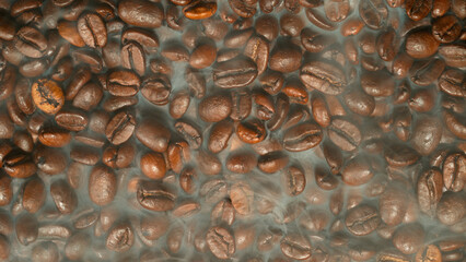 Roasting coffee beans with smoke permeating between the beans
