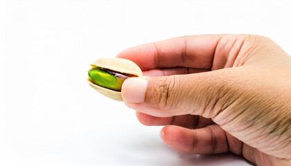 hand holding a pistachio 