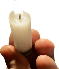 Small wax candle lit. Natural light from flame. Religious object from the Catholic church. Image with neutral and light background.