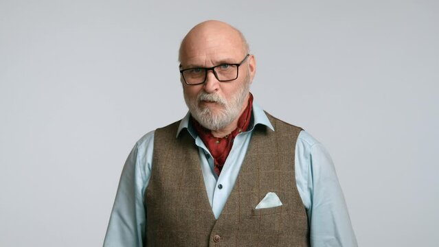 A middle-aged man awkwardly looking, showing through his facial expressions a lack of understanding of what he is seeing. The man in glasses and a classic vest with a neck scarf. Camera 8K RAW.
