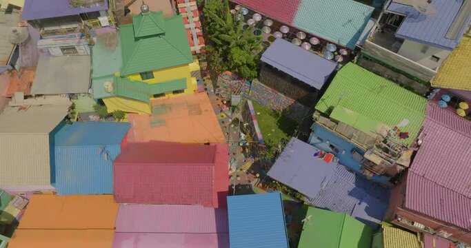 Aerial: Drone Panning Shot Of Colorful Houses In Famous Residential Village On Sunny Day - Java, Indonesia