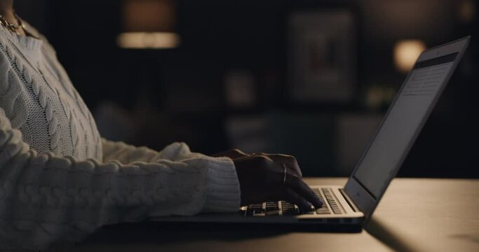 Laptop, home and hands of person at night for working on online project, proposal and research. Remote work, freelance and closeup of hands on computer keyboard for website, internet and networking