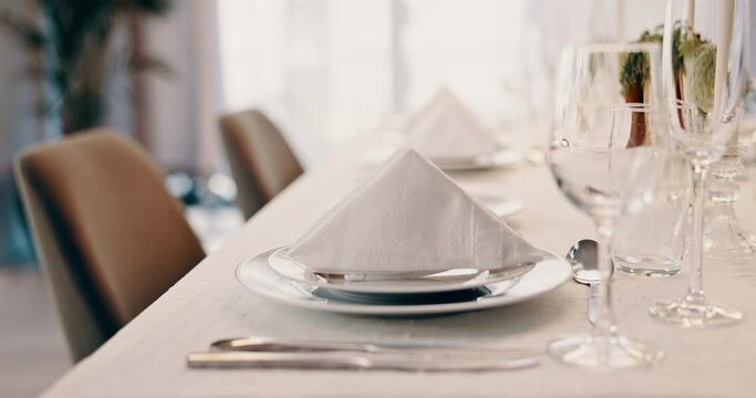 Home, glasses and fine dining with celebration, closeup and table with party, plates and success. Bubbles, drink and utensils with achievement at event, congratulations and birthday with decoration
