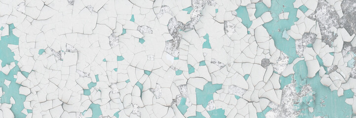 Peeling paint on the wall. Old concrete wall with cracked flaking paint. Weathered rough painted surface with patterns of cracks and peeling. Grunge texture for background and design. High resolution.