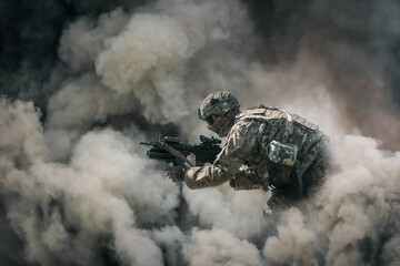 Military soldier between smoke and dust in battlefield	 - obrazy, fototapety, plakaty