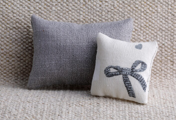 Two gray cushion on the sofa