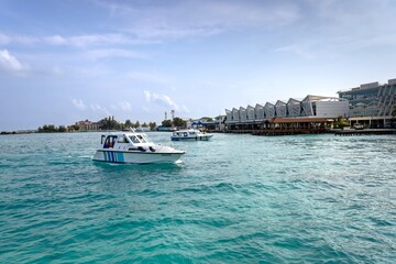 Small ferry boats sail near the Vilana International Airport ferry terminal, Malé, Maldives
