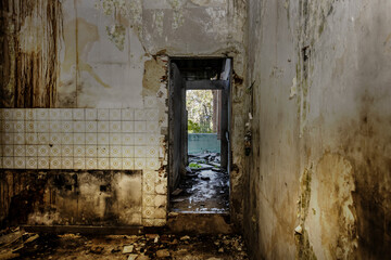Interior of a dilapidated house with a lot of dirt