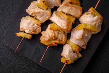 Delicious chicken or turkey kebab with pineapple pieces on skewers