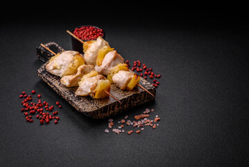 Delicious chicken or turkey kebab with pineapple pieces on skewers