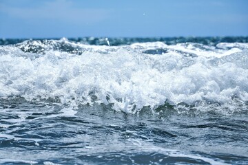 Blue sea  wiht wave and blue sky background. Summer sea and blue sky.
