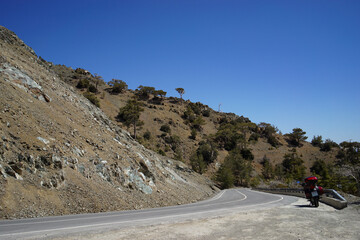 Red motorcycle on the road in the mountains