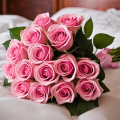 Bouquet of Pink roses on the bed in a hotel room for honeymoon. romantic meeting of guests at the hotel