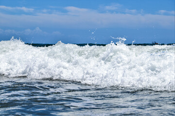 Blue sea  wiht wave and blue sky background. Summer sea and blue sky.