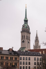 Obraz premium Munich, Germany - May 01, 2022: Church bell tower in the cultural center of Munich