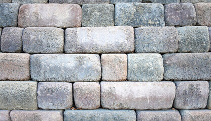 Close up of a stacked stone wall.
